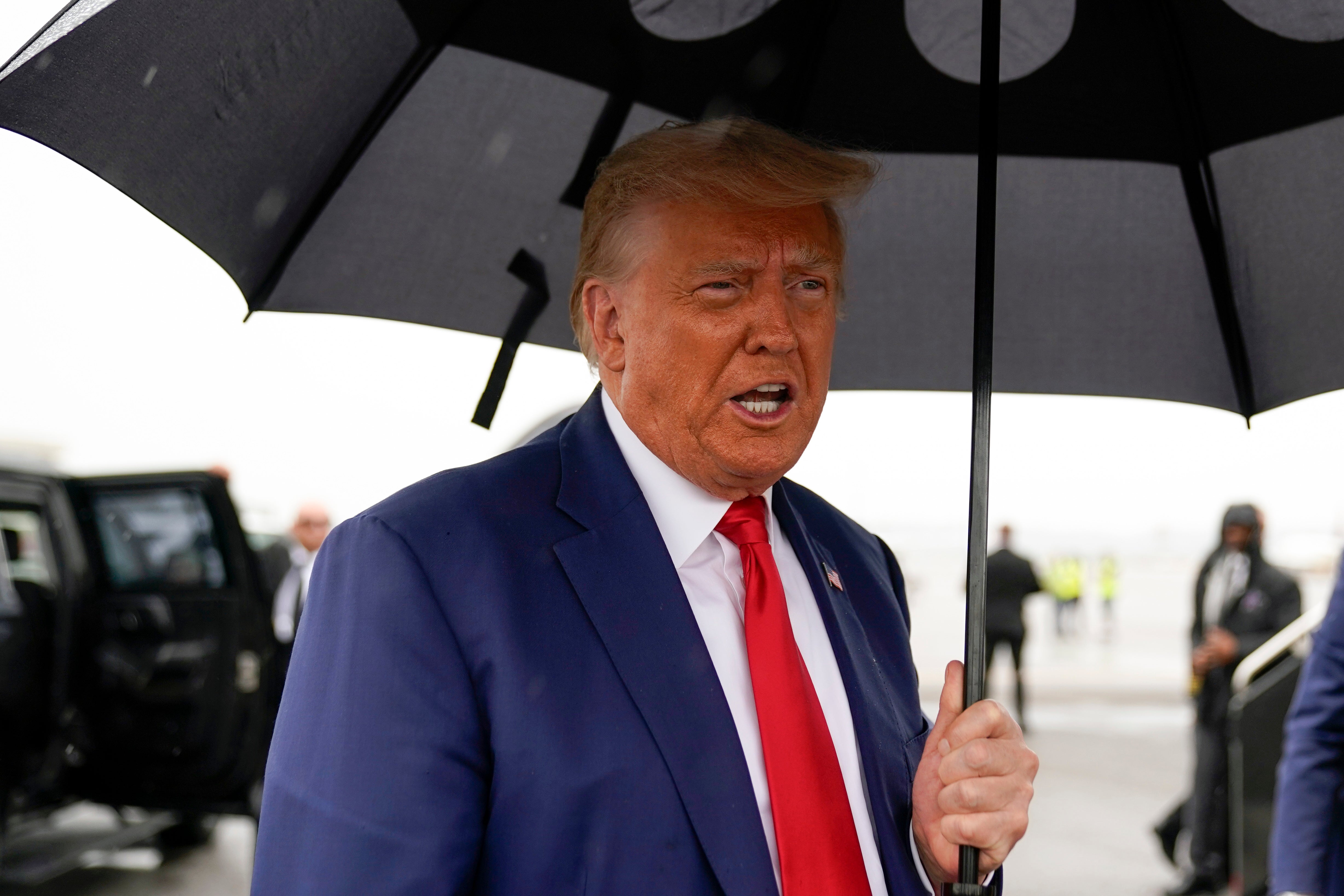 Former President Donald Trump speaks before he boards his plane at Ronald Reagan Washington National Airport after arraignment last week