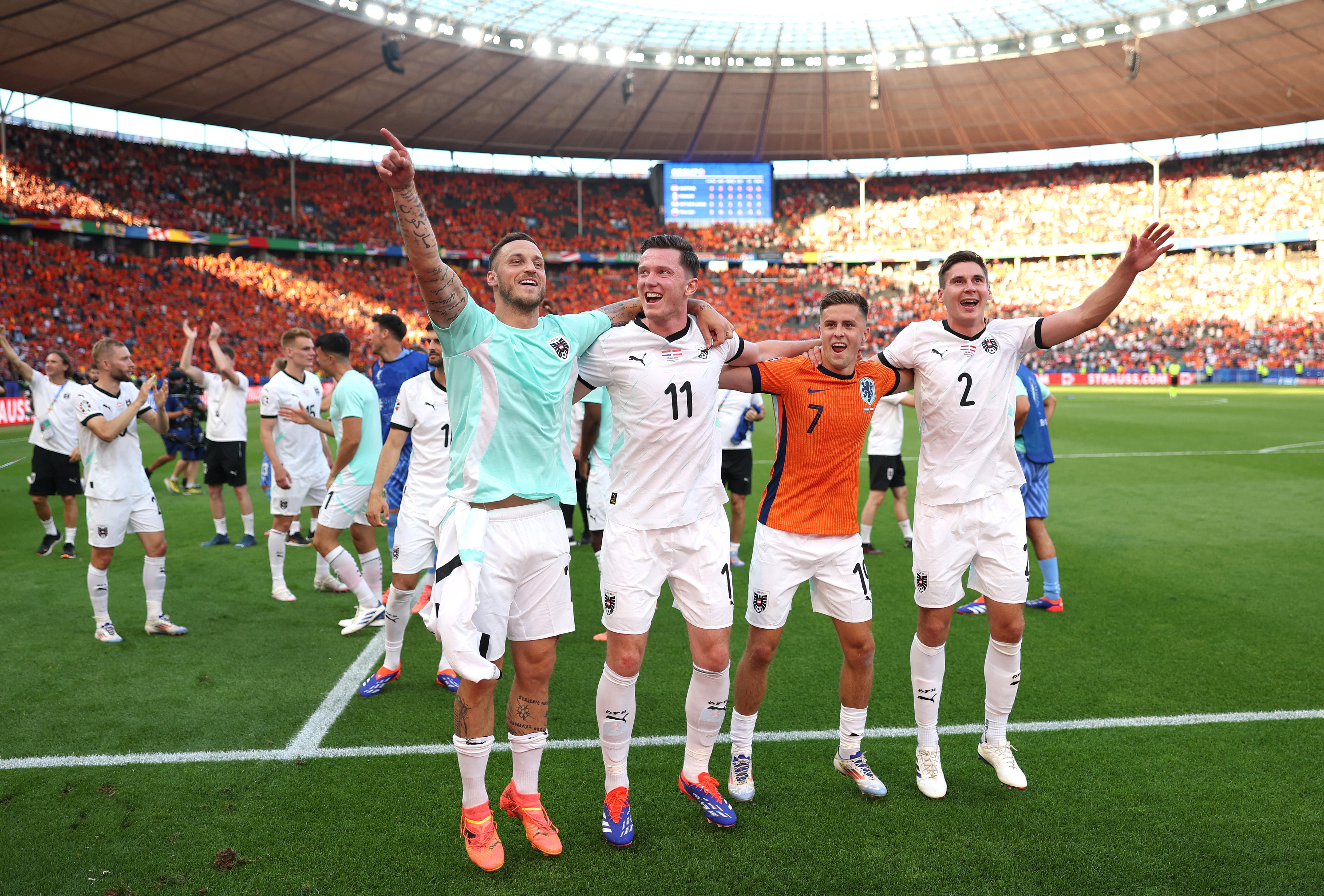 Austria celebrate after beating the Netherlands to top the group