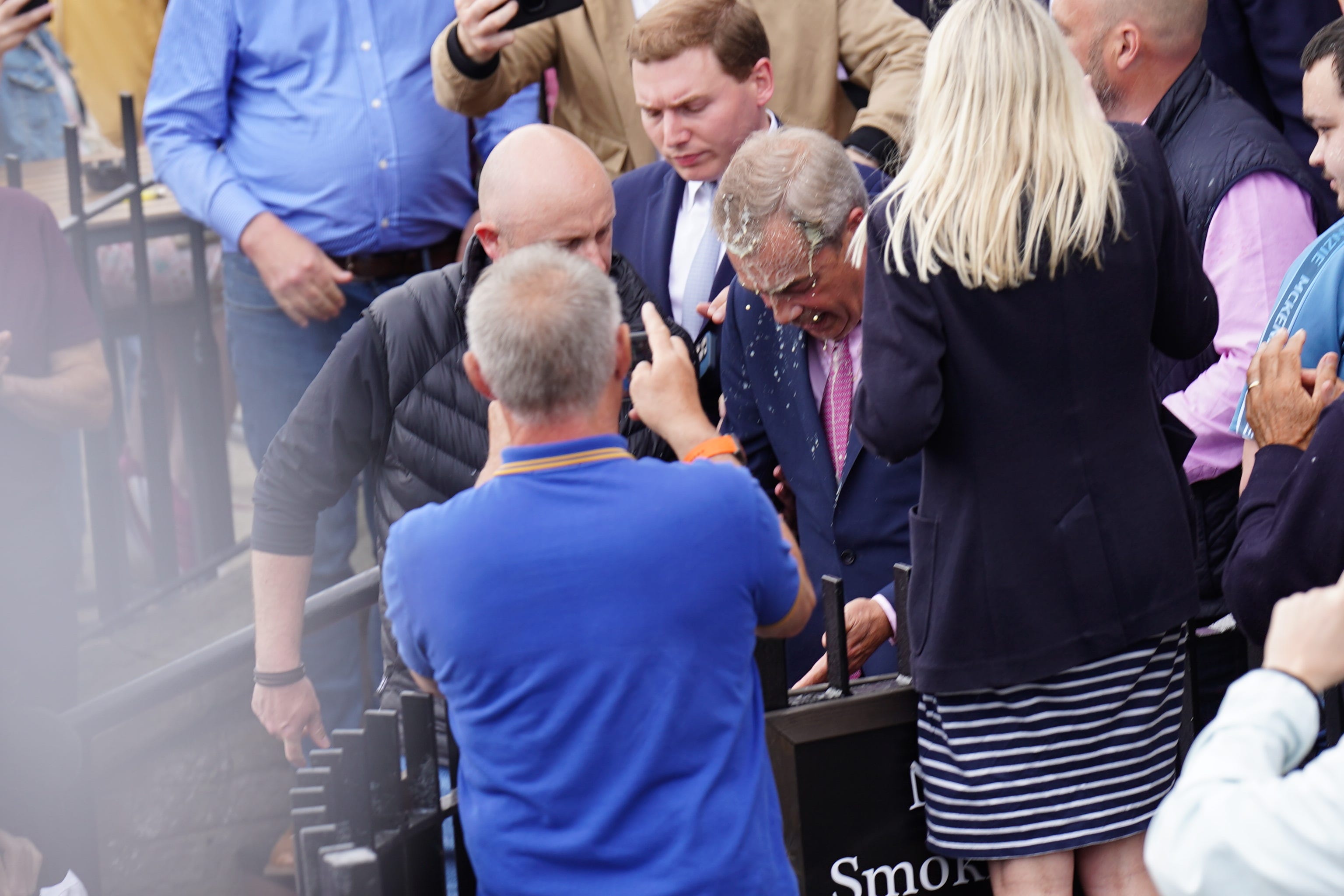Leader of Reform UK Nigel Farage had a drink thrown over him (PA)