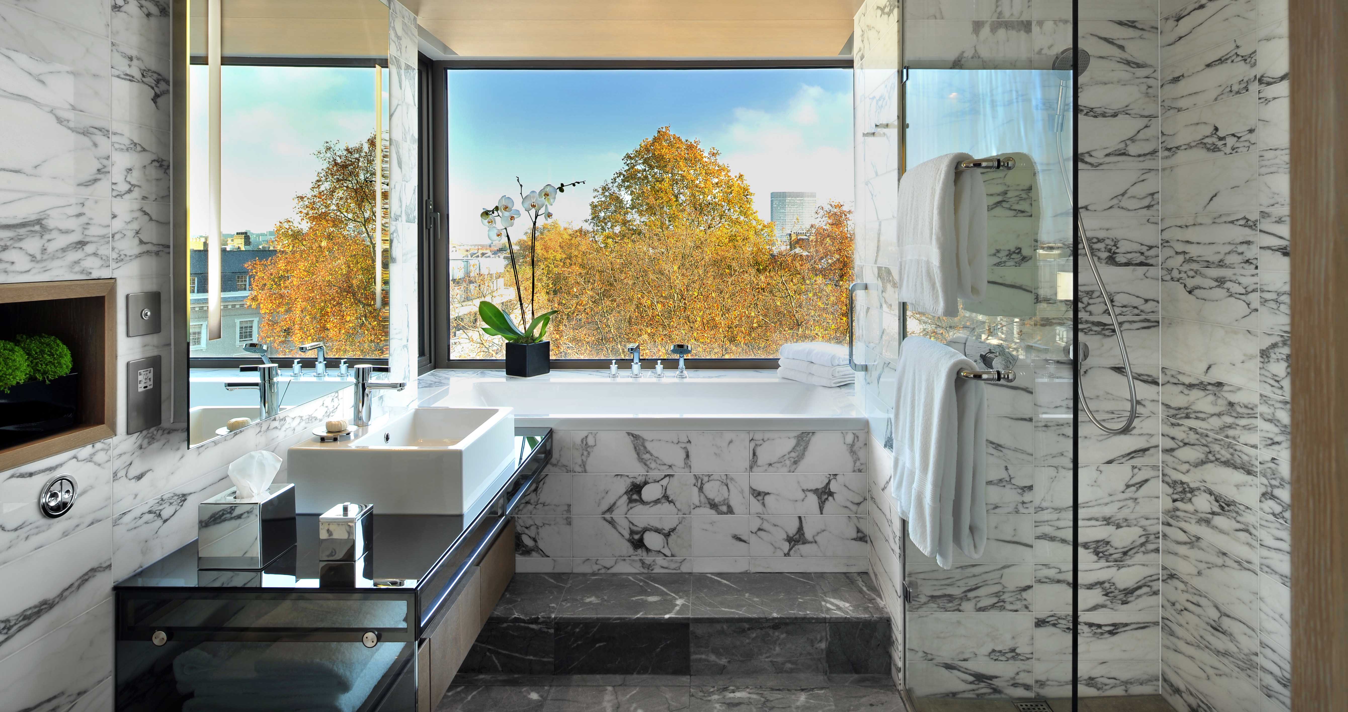 There’s wall-to-wall Arabescato marble in the bathroom