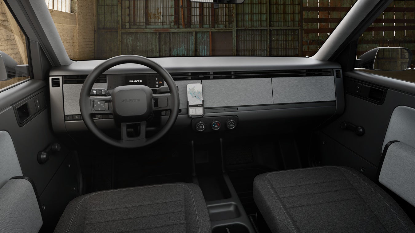 The Slate EV’s interior doesn’t get an infotainment screen but you can buy a holder for your tablet or smartphone